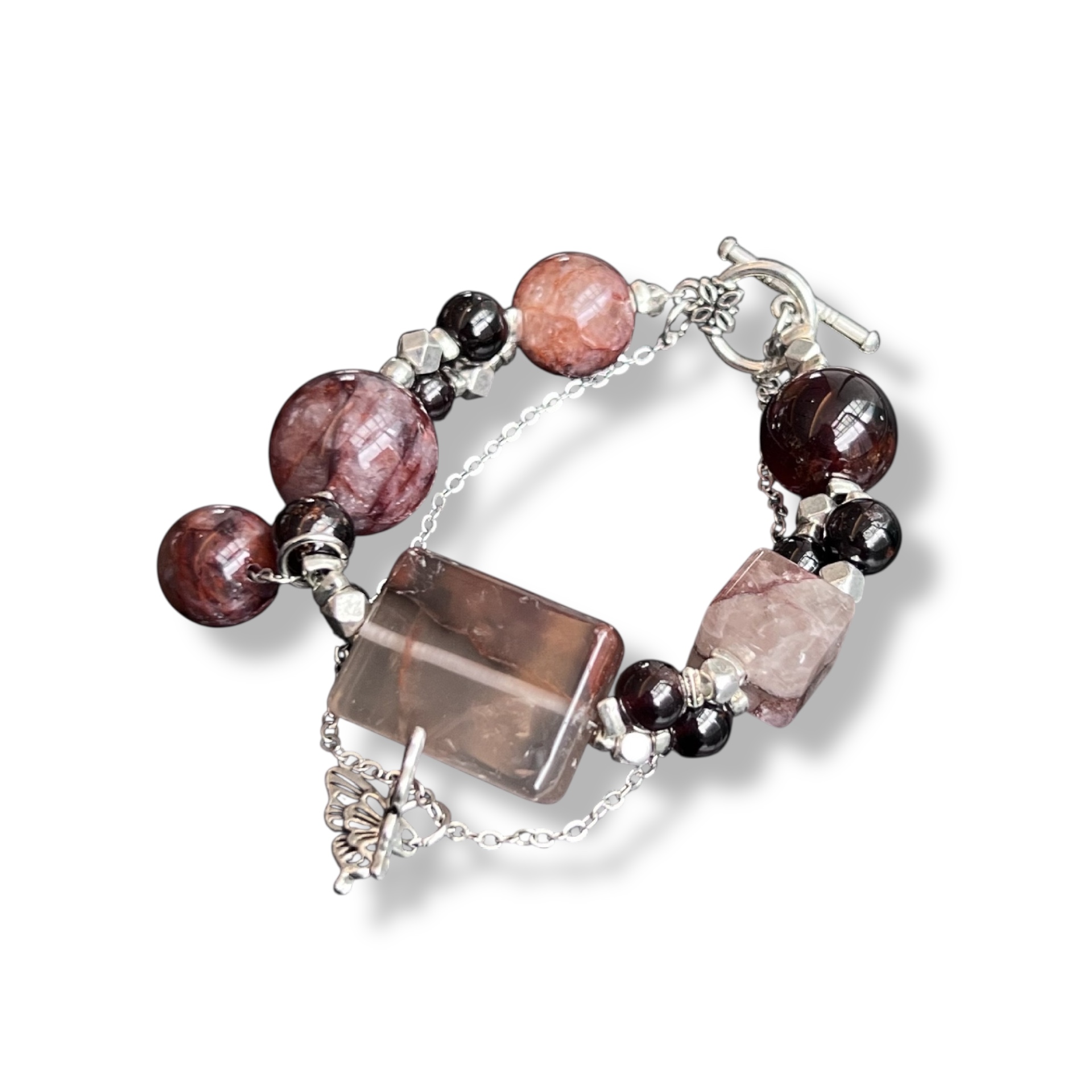 Tea brown crystal bracelet featuring rectangular smoky quartz and round garnet on white background