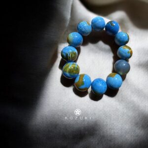 Spiritual gemstone bracelet with blue earth-patterned agate